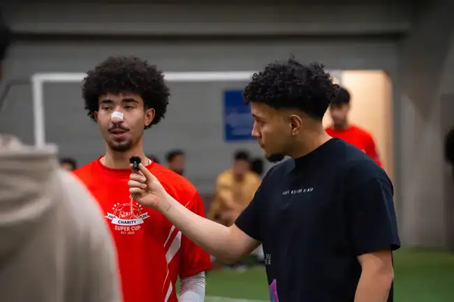 Candid moment between players pitchside