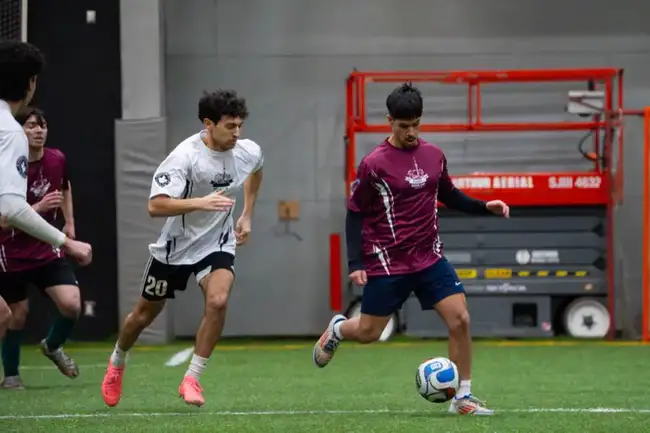 Player dribbling past a defender