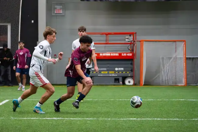 Players sprinting for possession mid-match