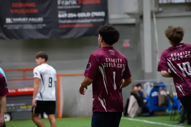 Team in maroon jerseys in action