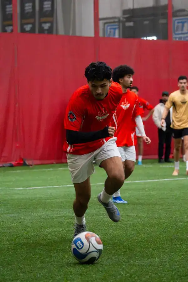 Team in red jerseys in action