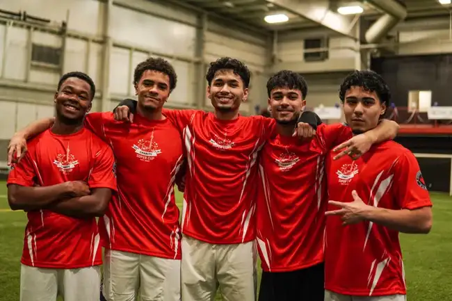 Teammates posing together after a match