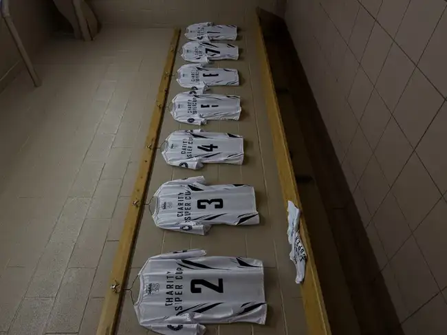 Charity Super Cup jerseys hanging in the locker room